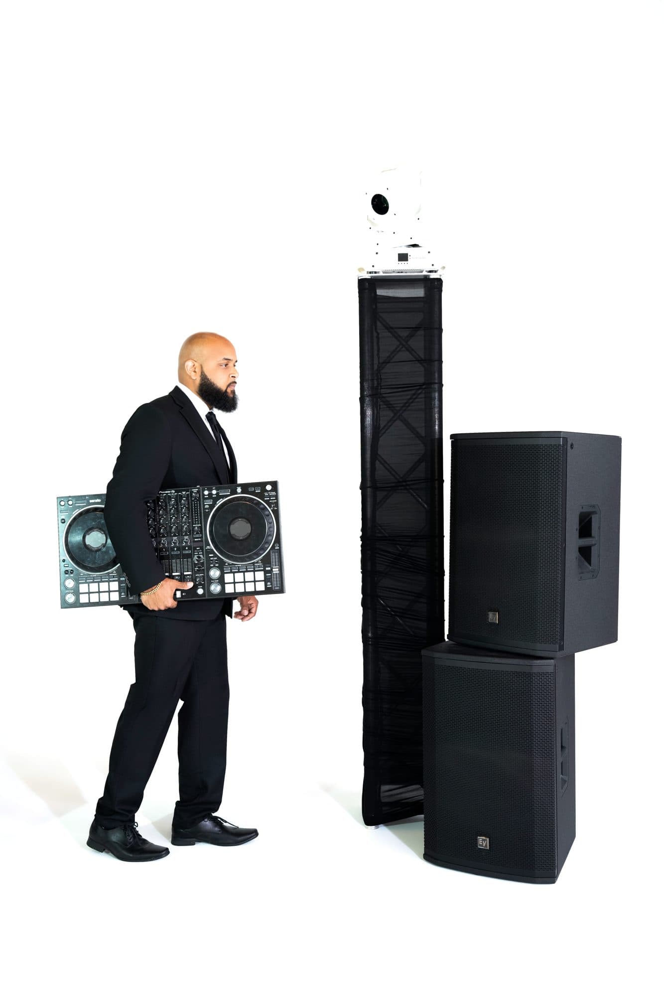 SB Mega Events DJ standing beside the Pioneer controller