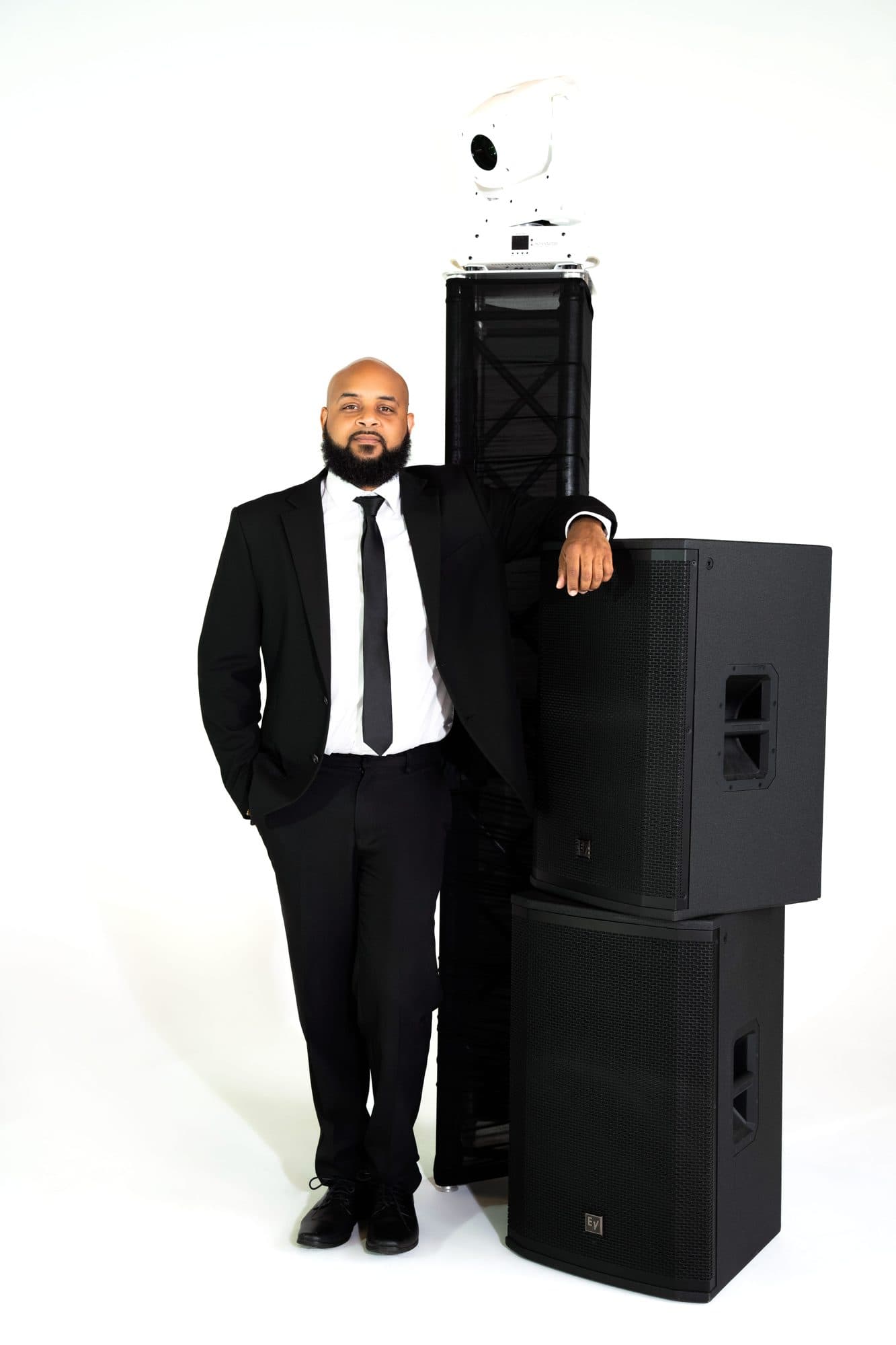 SB Mega Events DJ with full booth, speakers, and lighting tower
